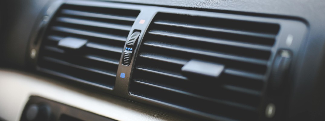 A stock photo of a car's air conditioner vents.