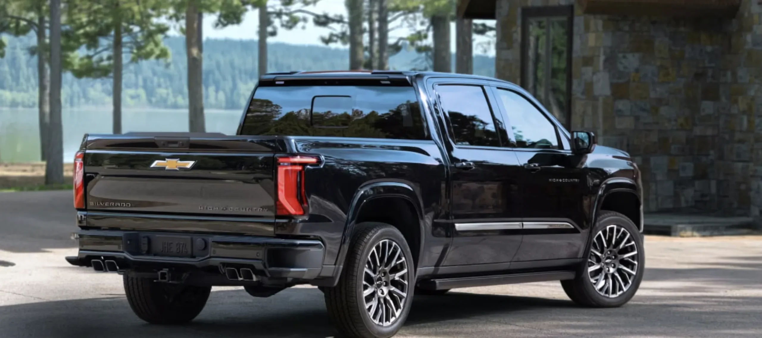 Rear side view of parked 2027 Chevrolet Silverado High Country